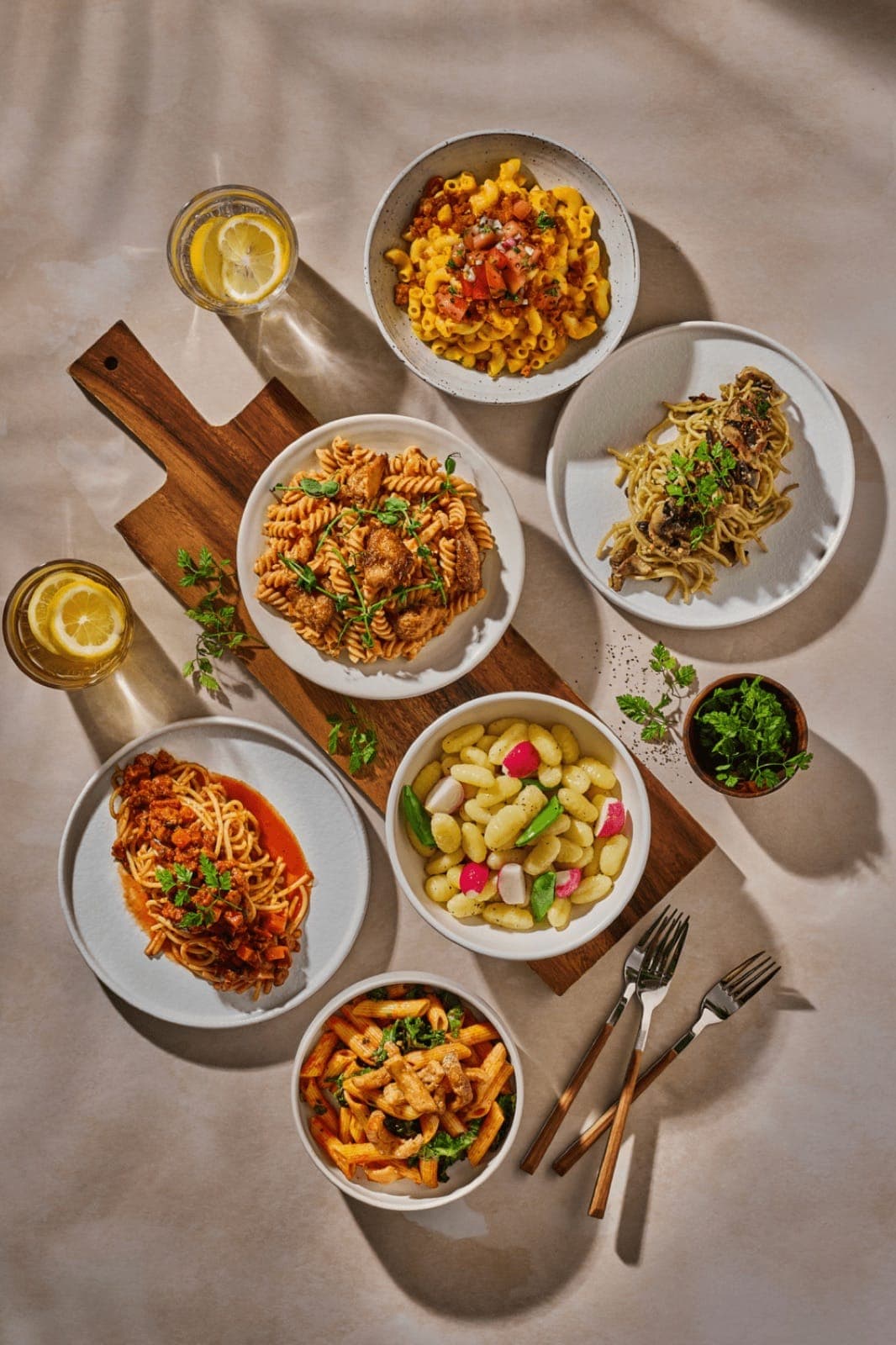 Pasta dishes laid out for a group